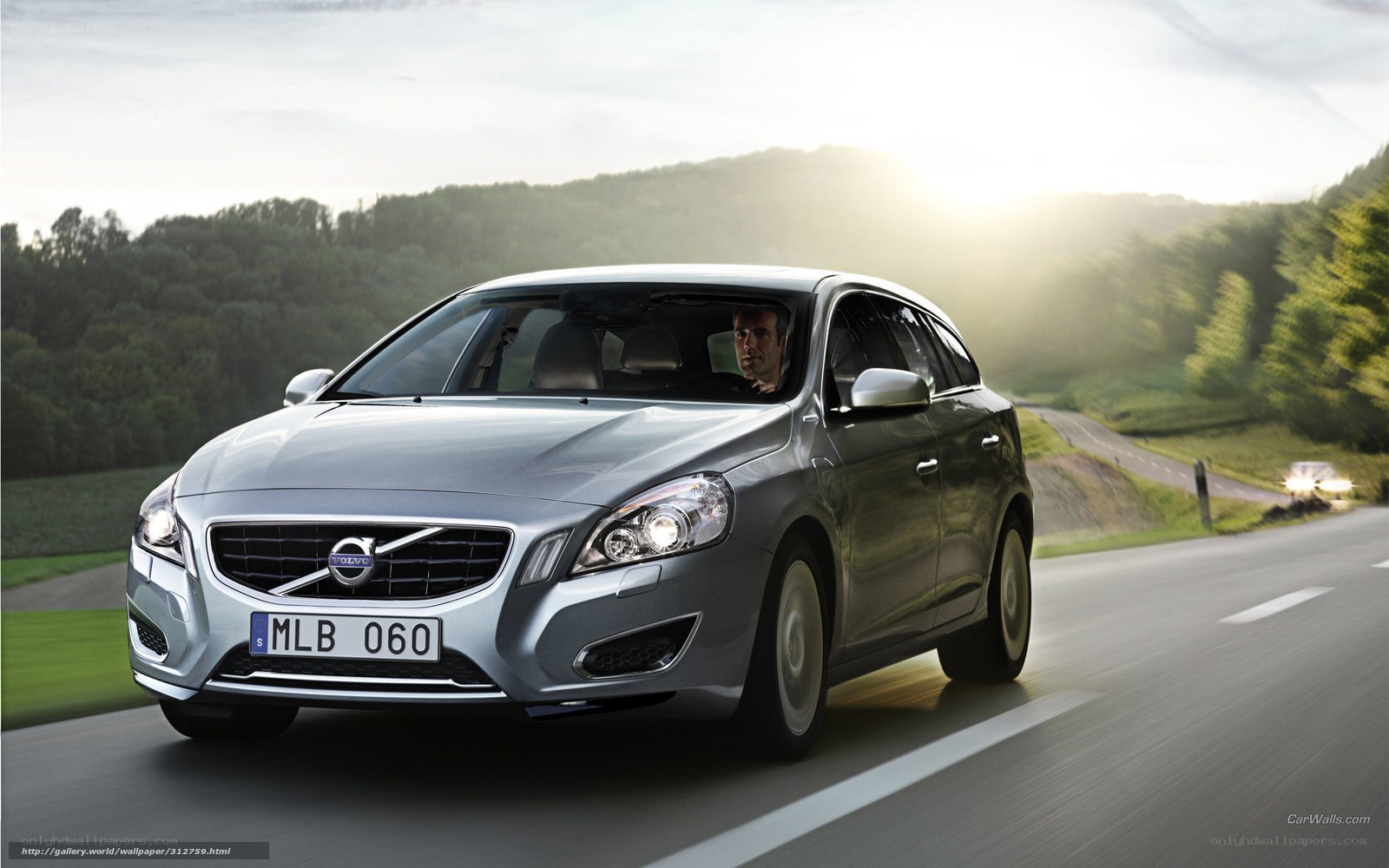 silver volvo on country road
