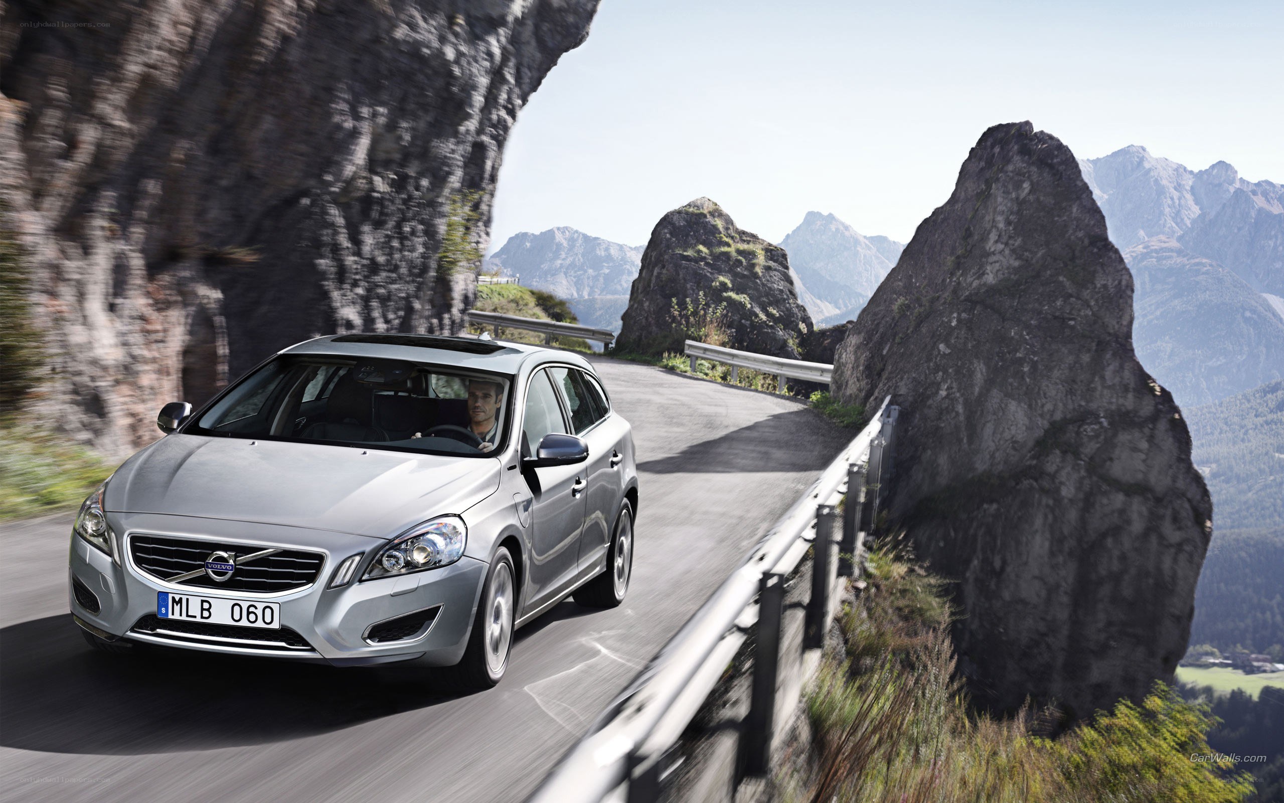 Silver Volvo on mountain road