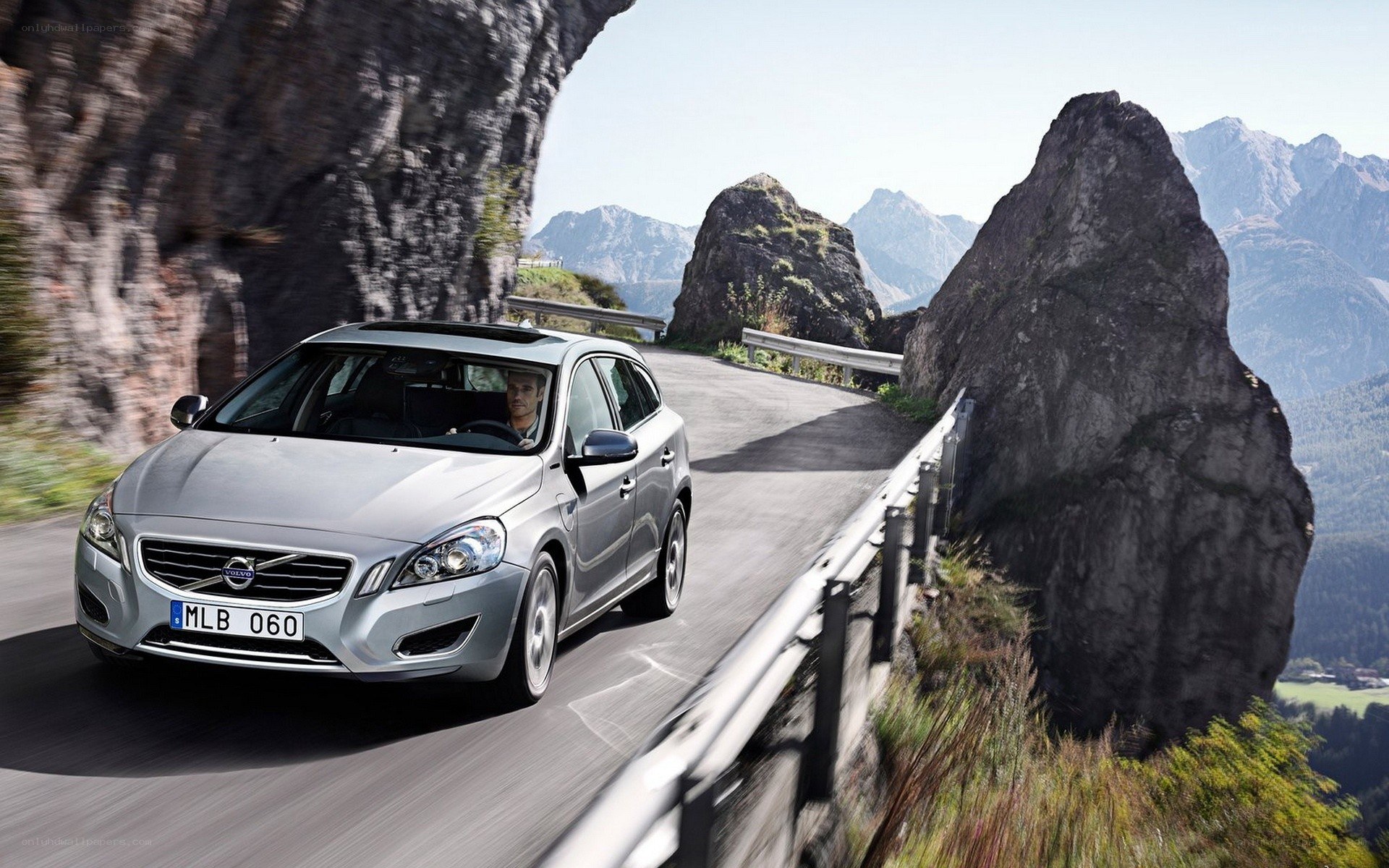 Silver Volvo on mountain road