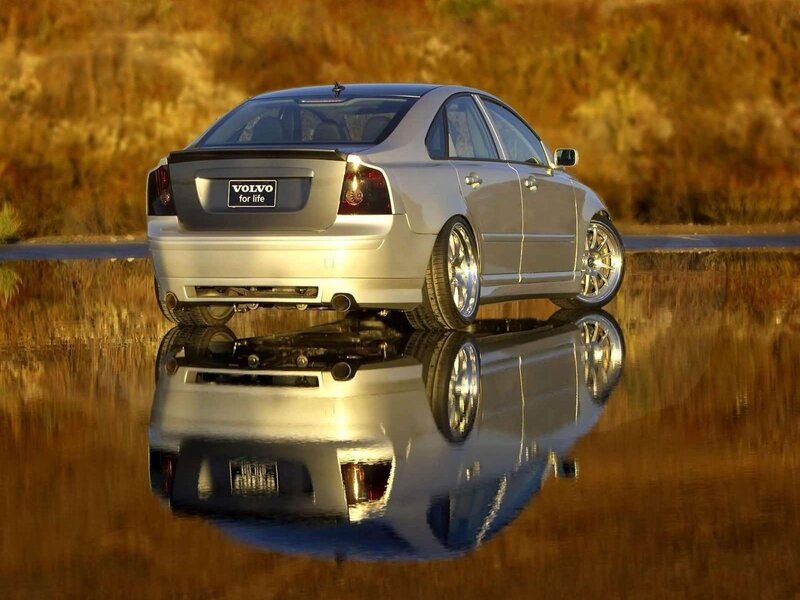 Silver Volvo on reflective water