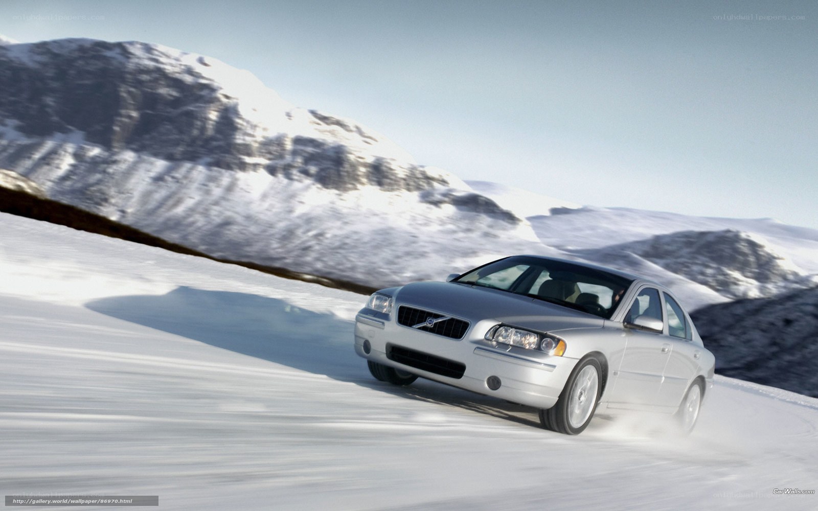 silver volvo on snowy road