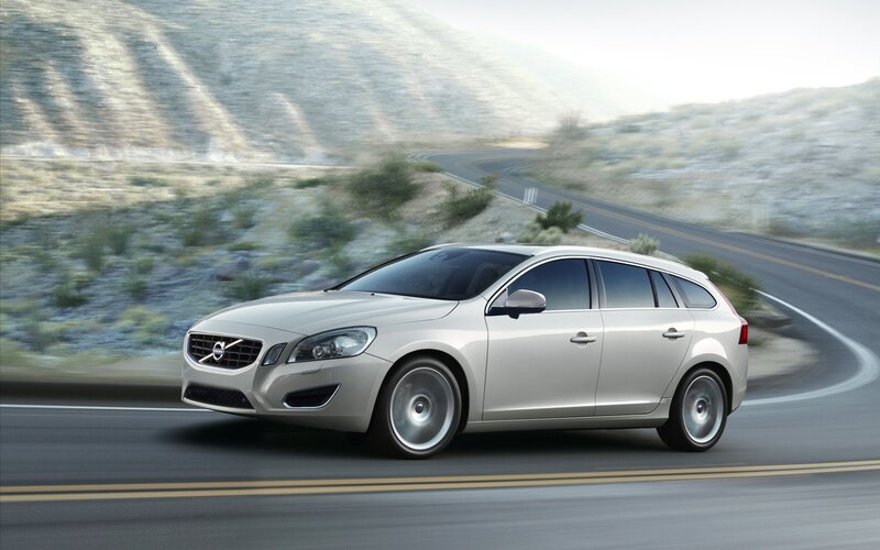 silver volvo on winding road