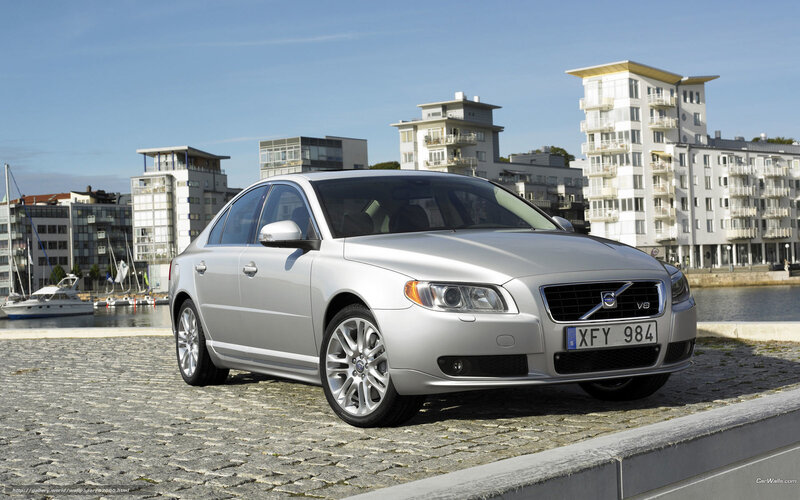 Silver Volvo S80 by the harbor