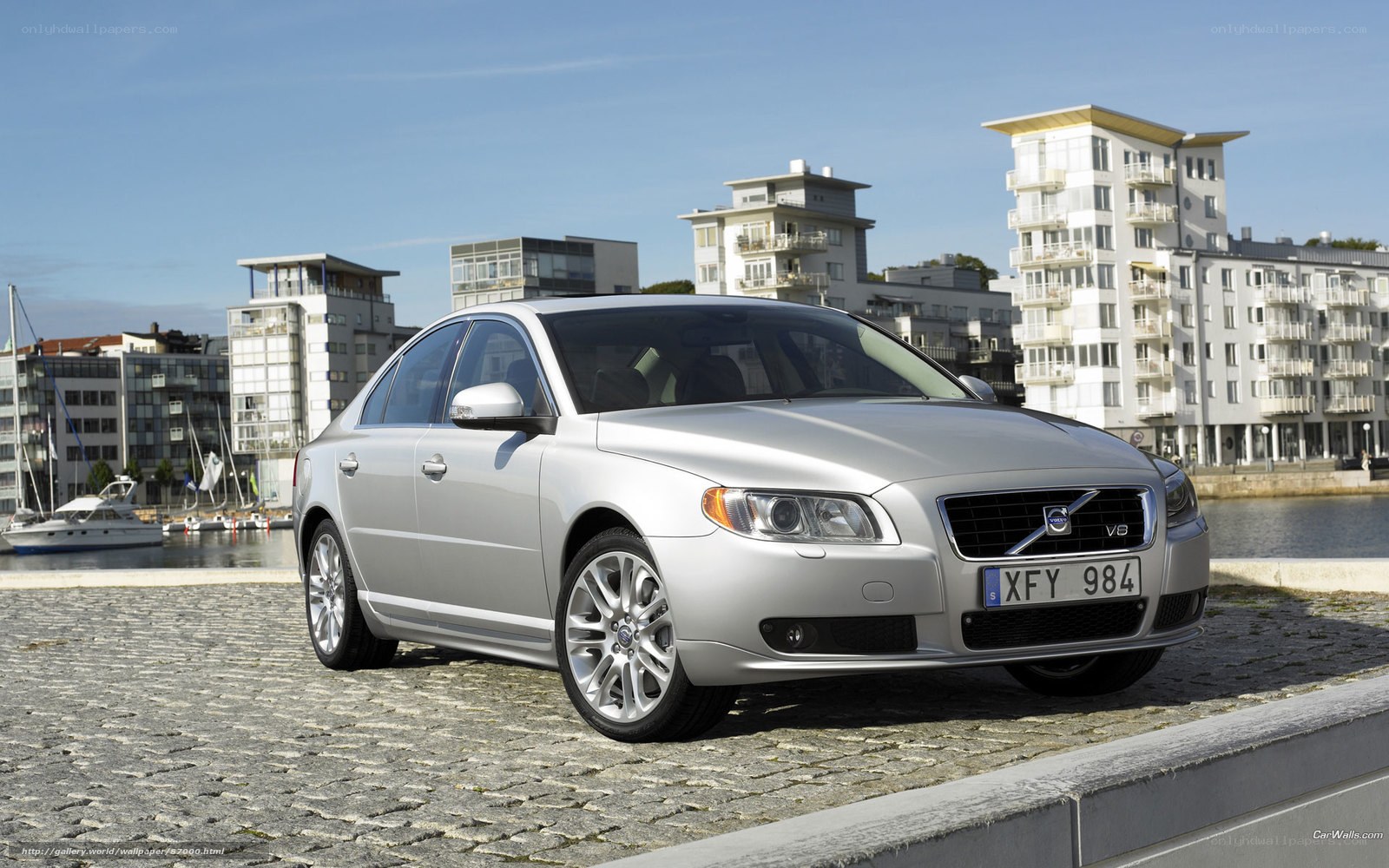 Silver Volvo S80 by the harbor