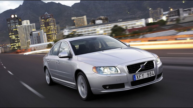 Silver Volvo S80 driving in city