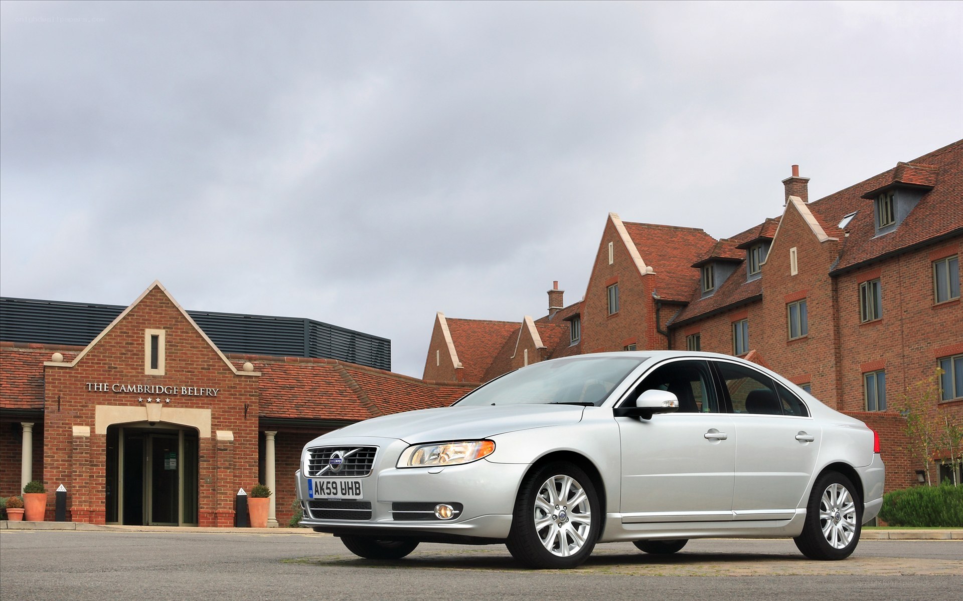 Silver Volvo S80 outside hotel