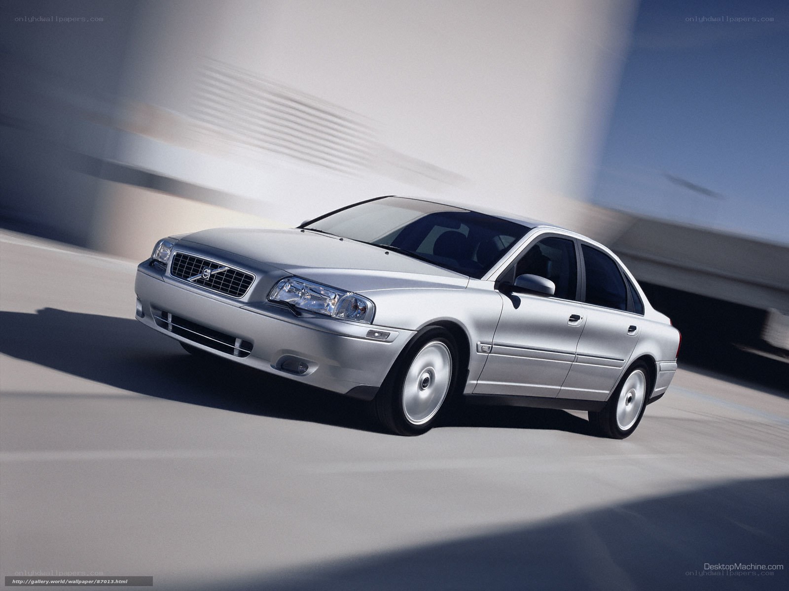 silver volvo sedan in motion