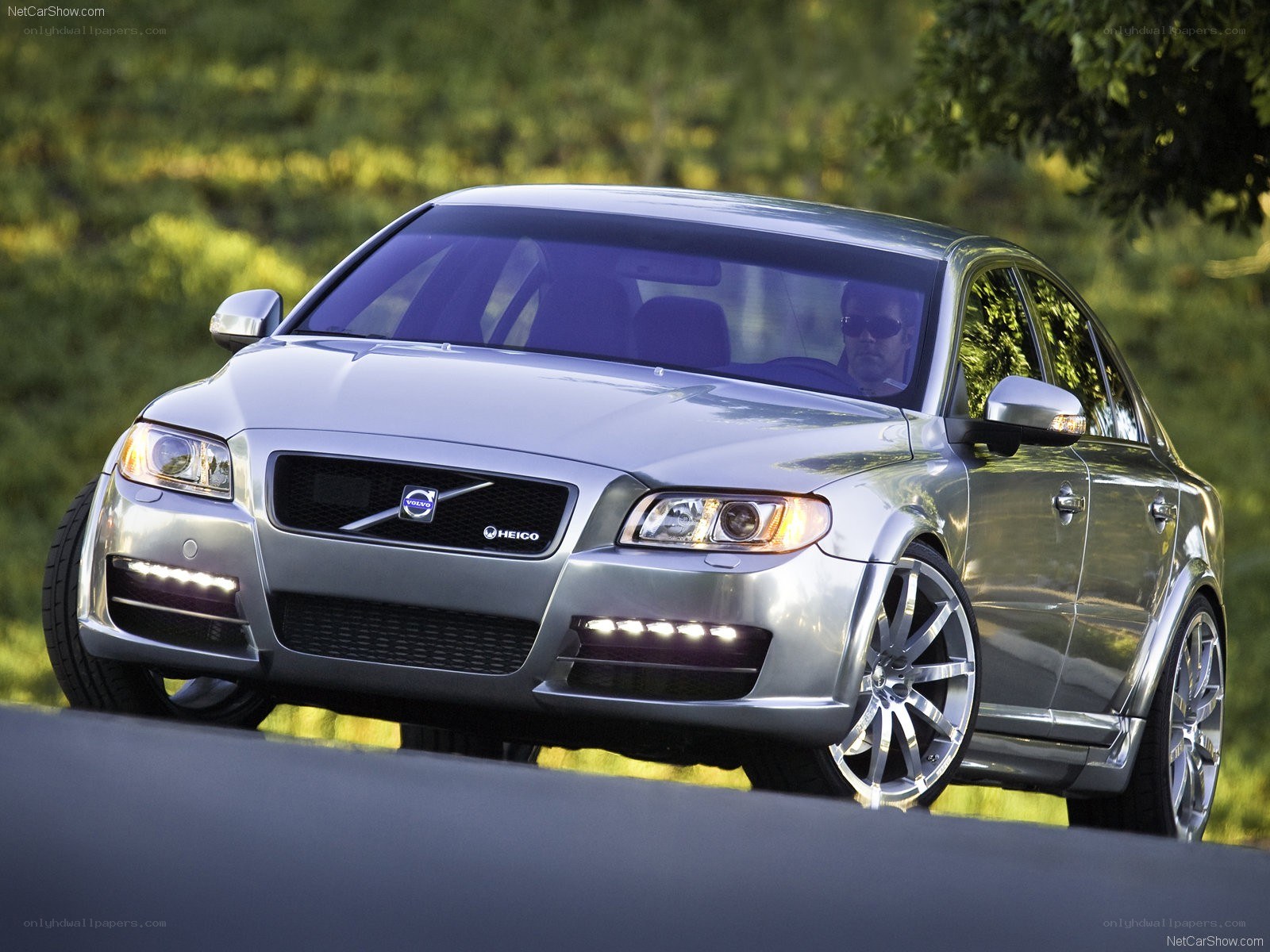 silver volvo sedan on road