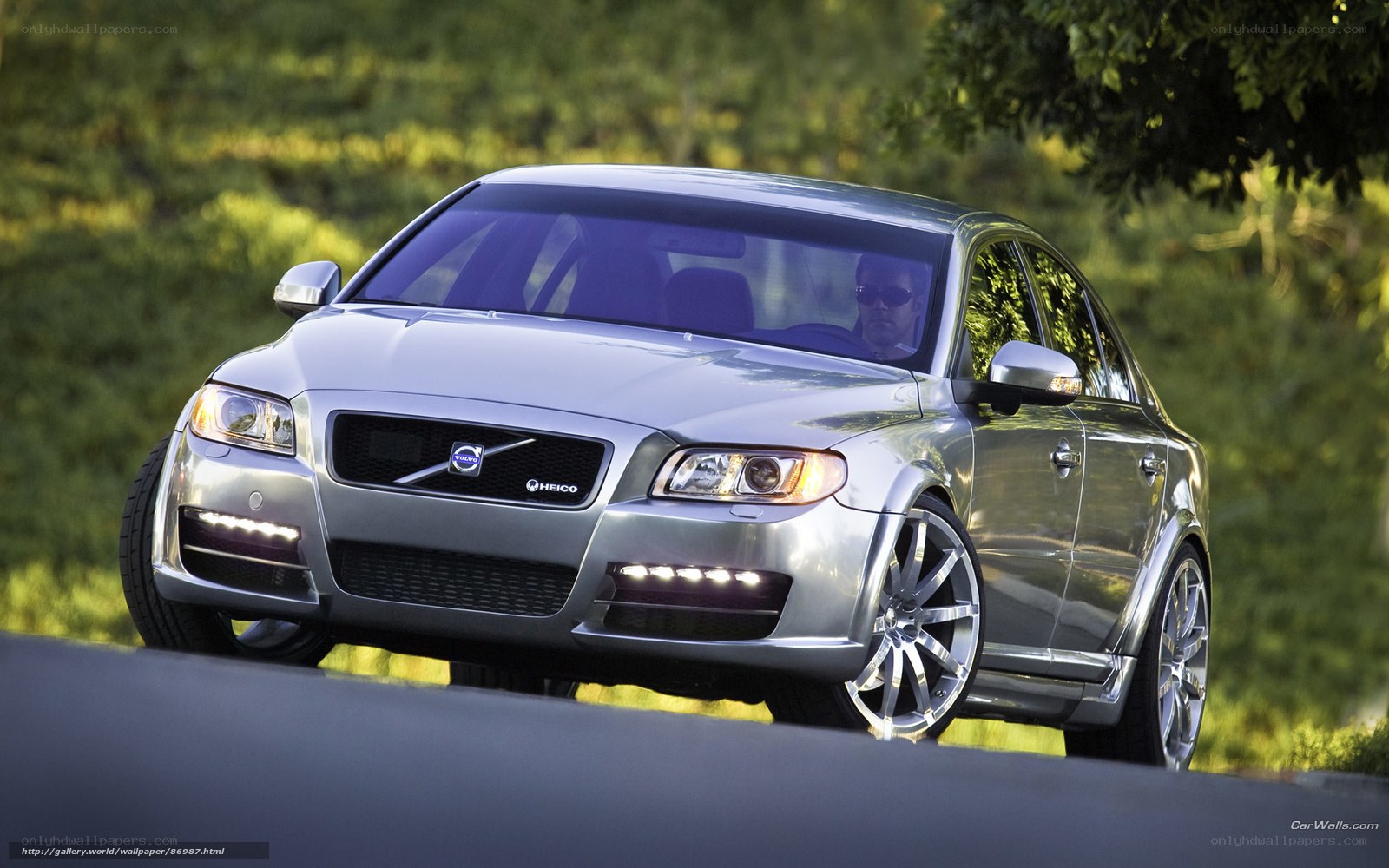 silver volvo sedan on road