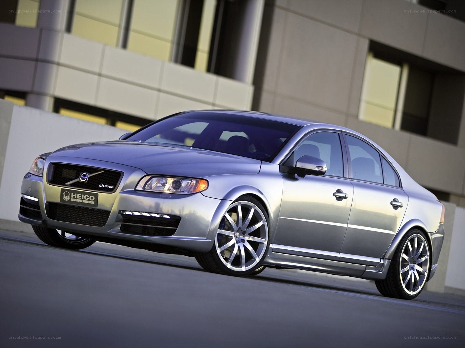 silver volvo sedan with custom wheels