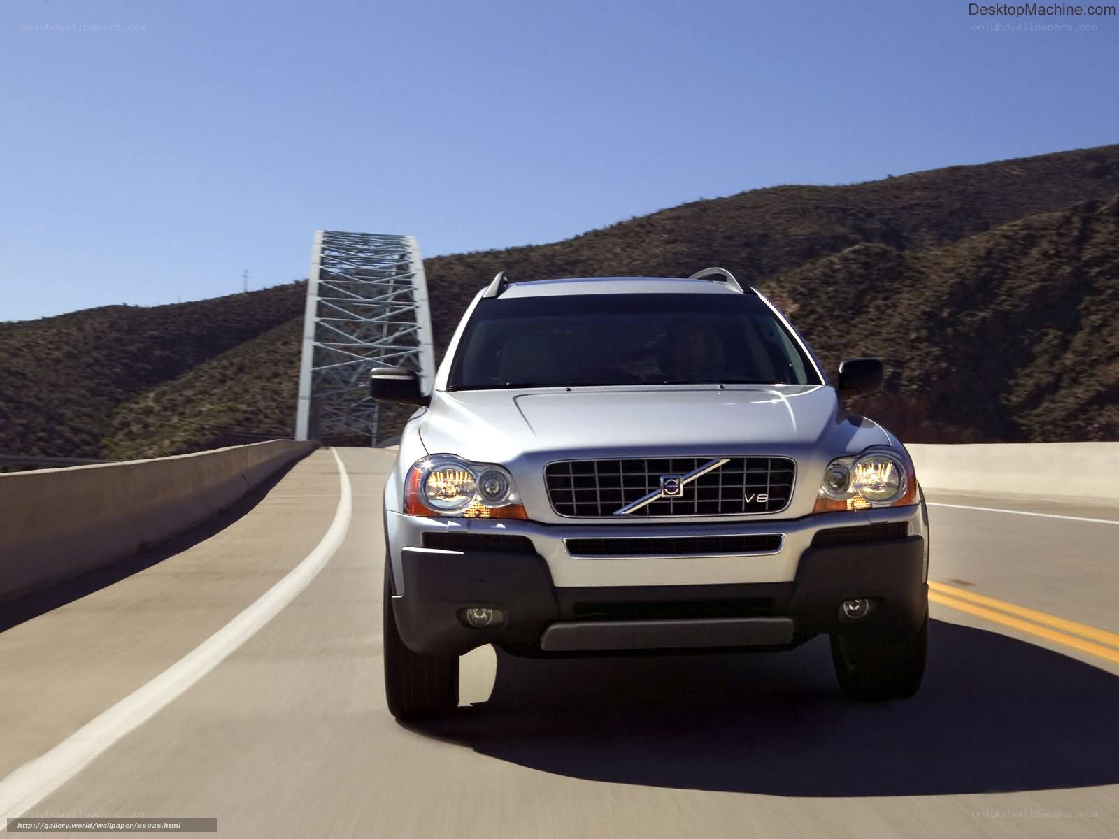 silver volvo suv on a bridge