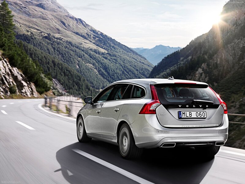 Silver Volvo V60 driving on mountain road