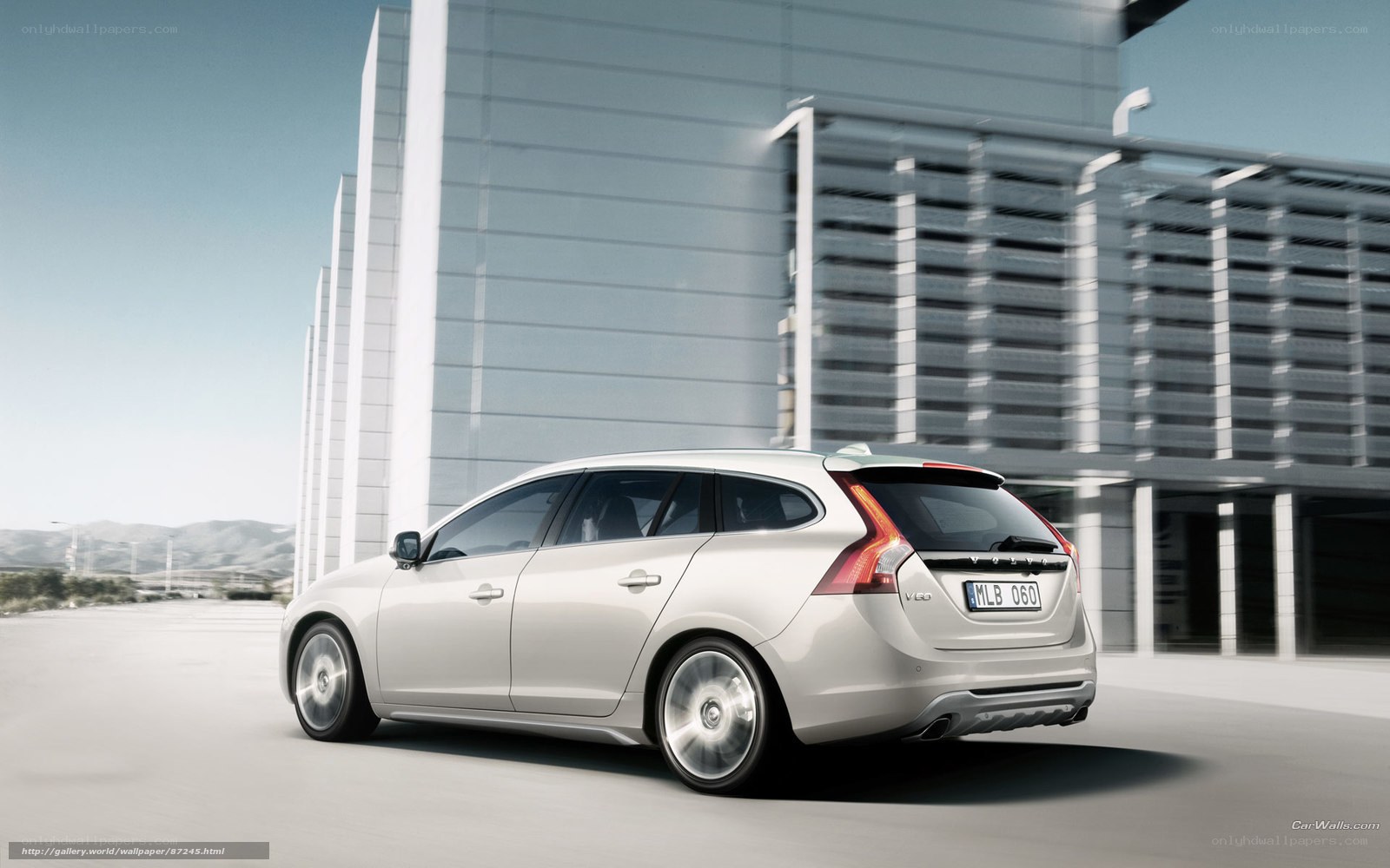 silver volvo v60 in motion