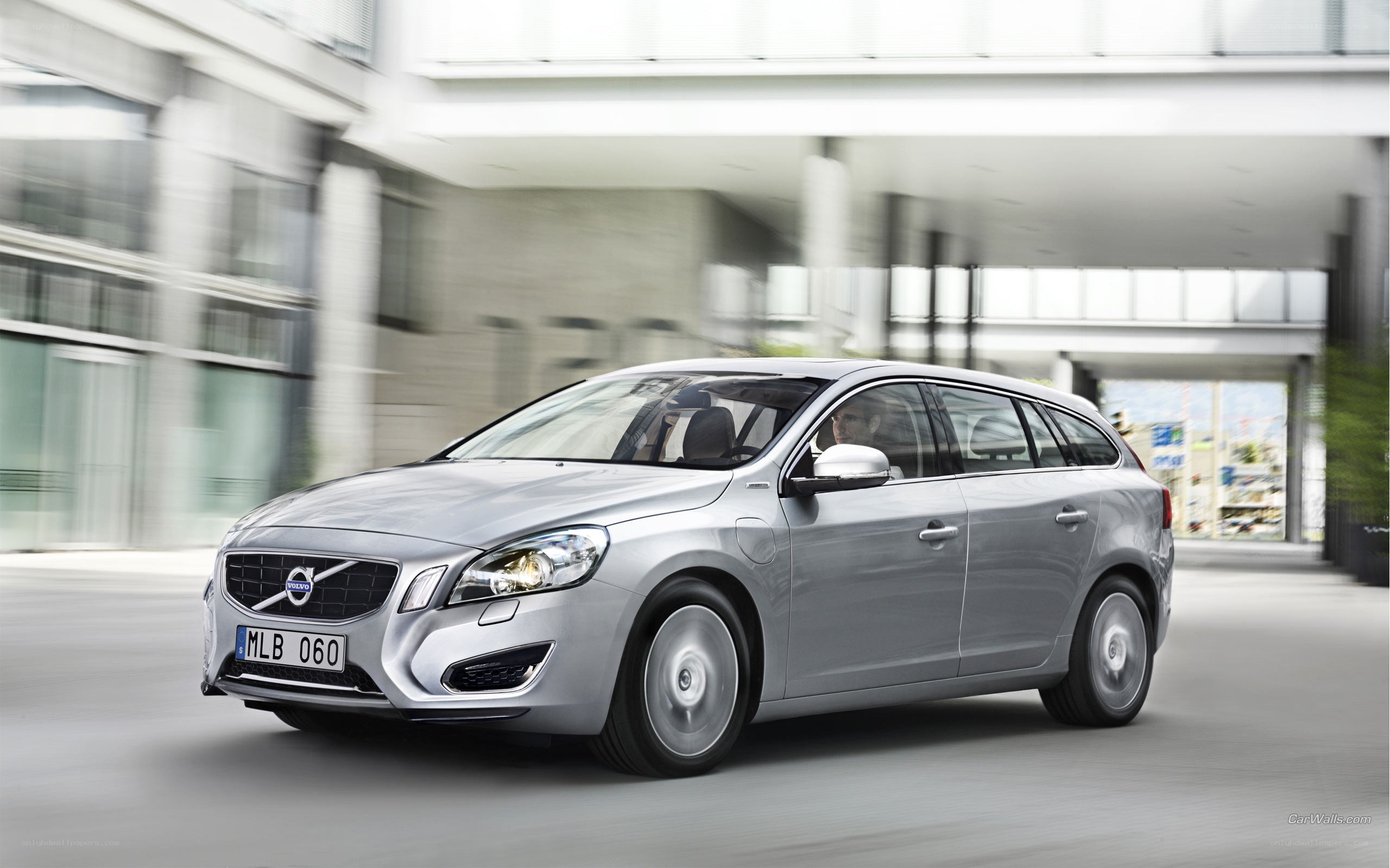 silver volvo v60 in motion