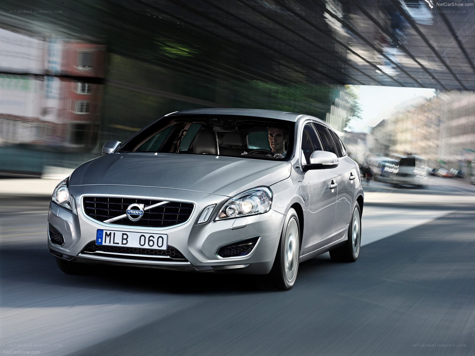 silver volvo v60 in motion