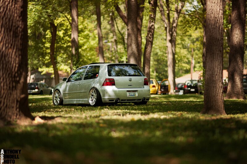 Silver VW Golf in a park