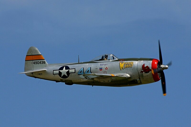 Silver Warplane in Flight — Blue, Clear