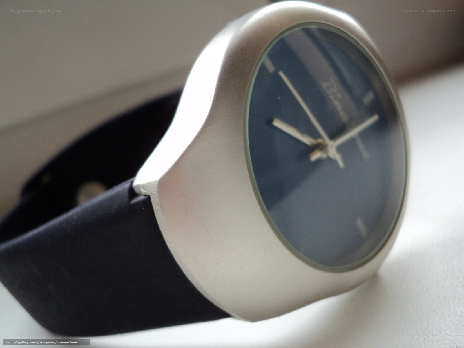 silver watch with black strap