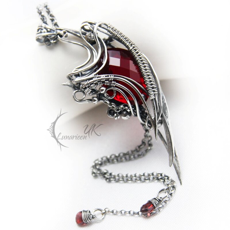 Silver Wire Pendant — Dramatic, Photograph