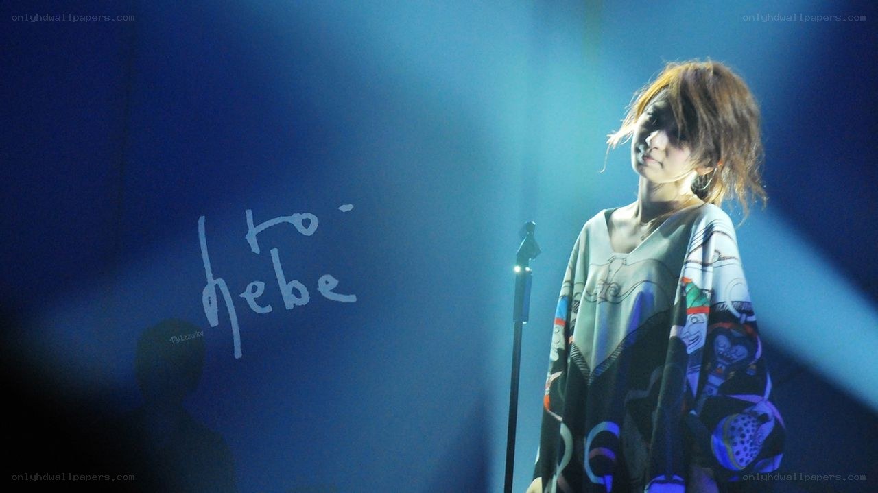 singer on stage with blue lighting