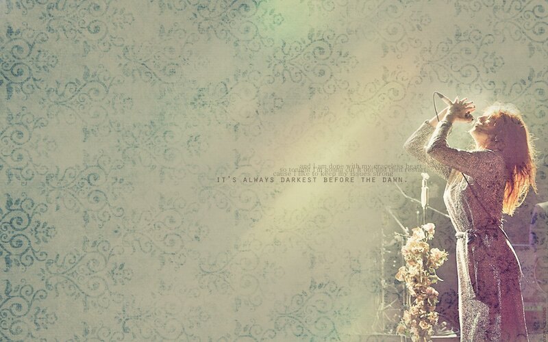 singer on stage with lyrics