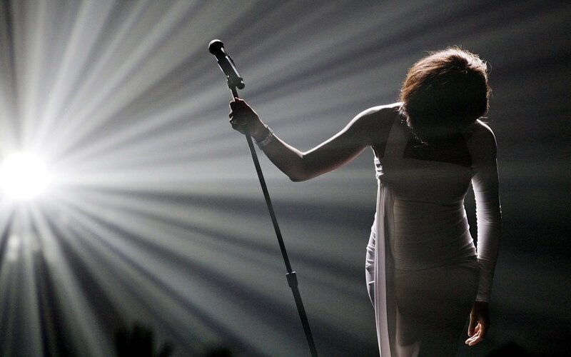 singer on stage with microphone