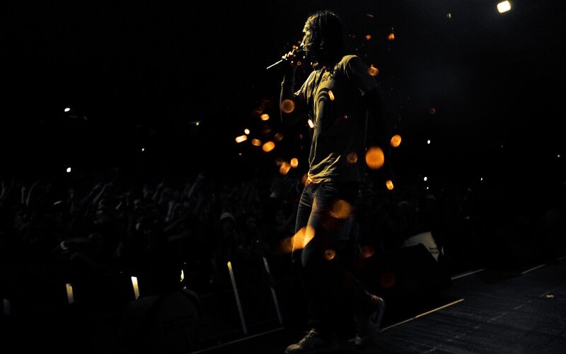 Singer on Stage with Microphone — Black