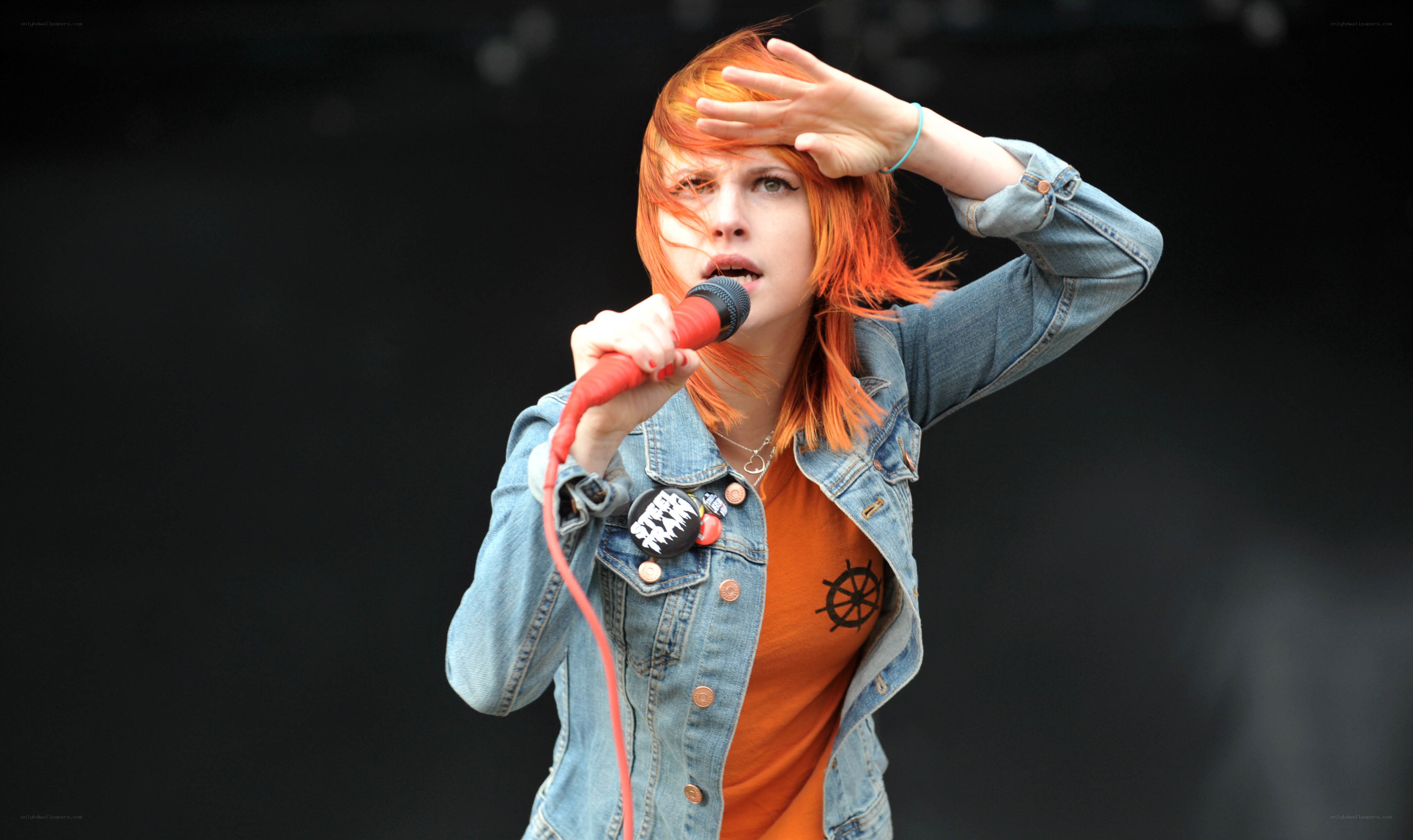 singer performing on stage