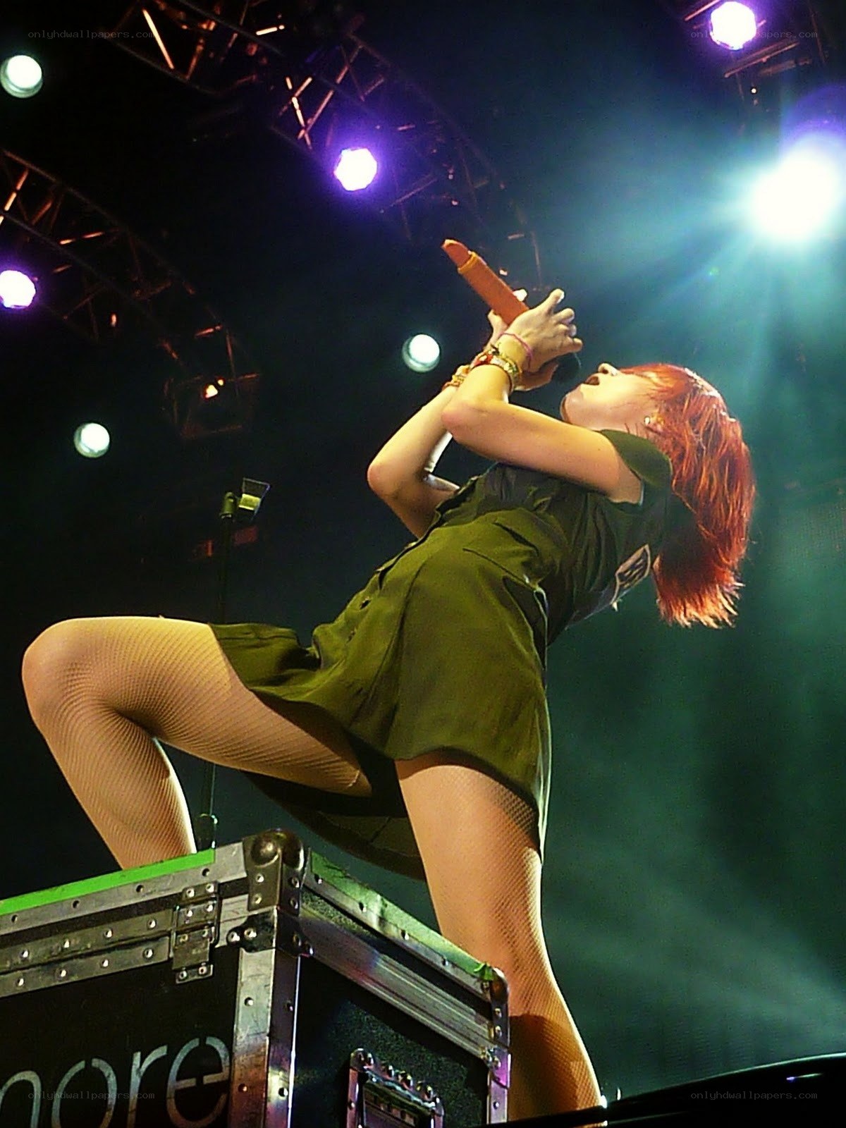 singer performing on stage