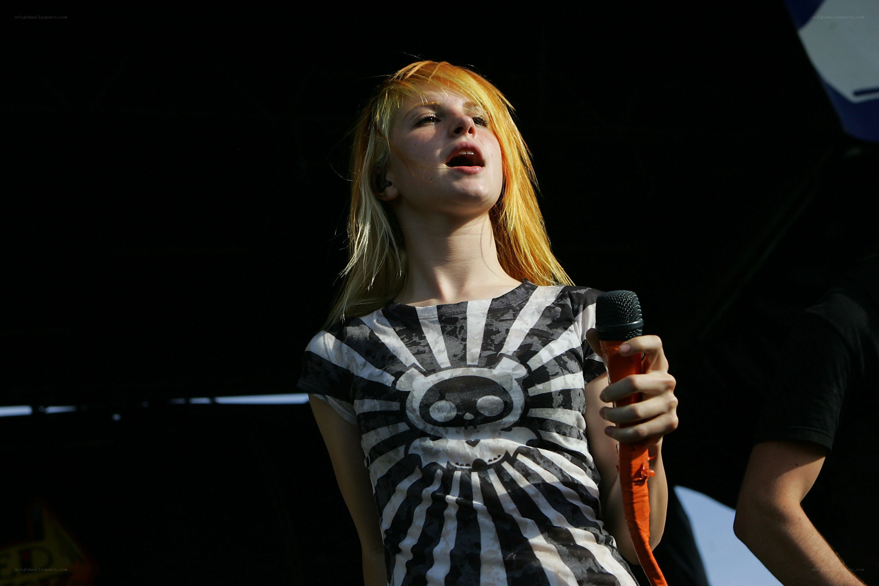 singer performing on stage