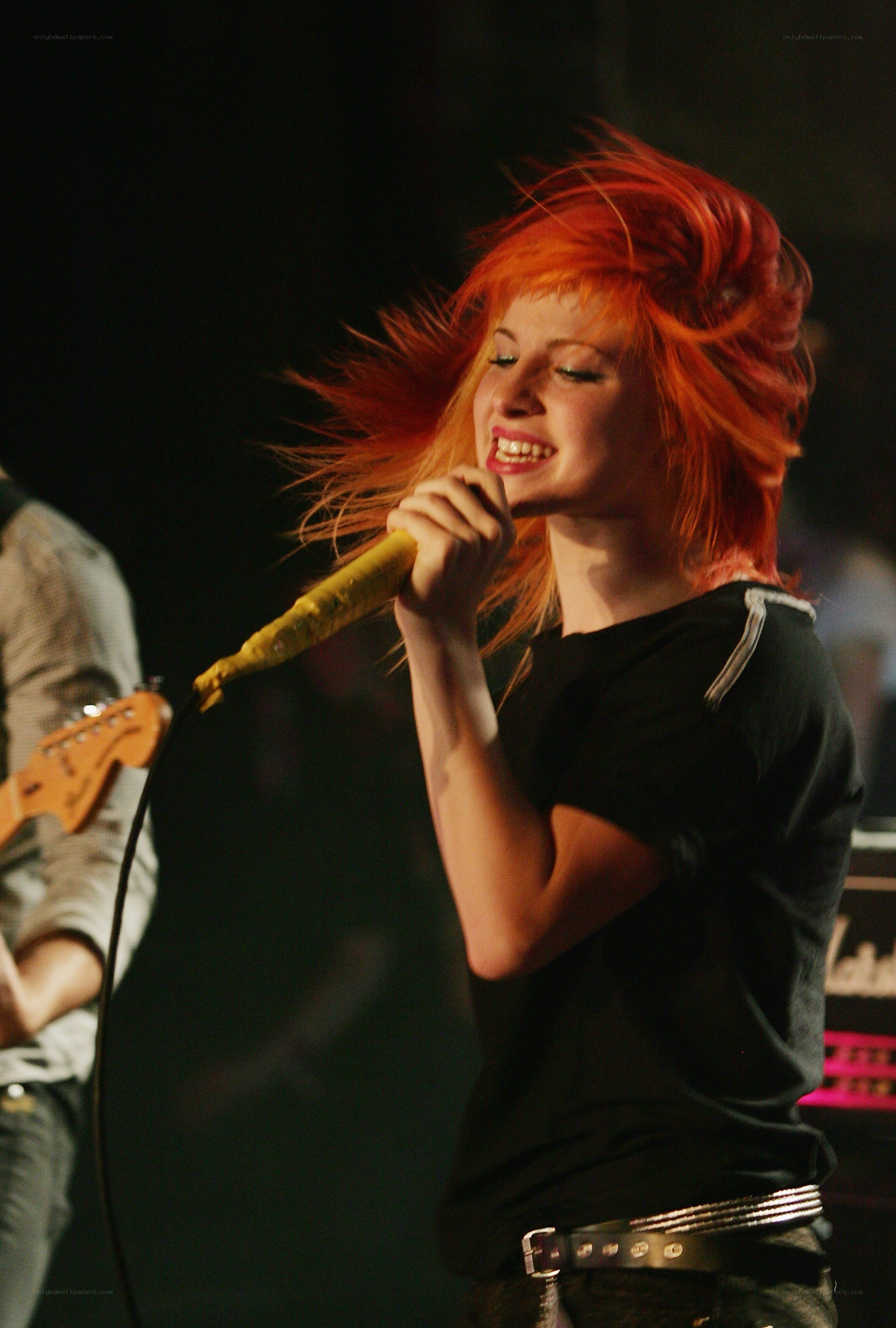 singer performing on stage
