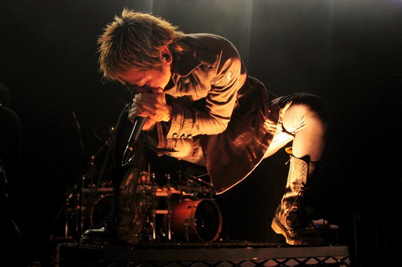Singer Performing on Stage — Black, Dramatic, Night, Photograph