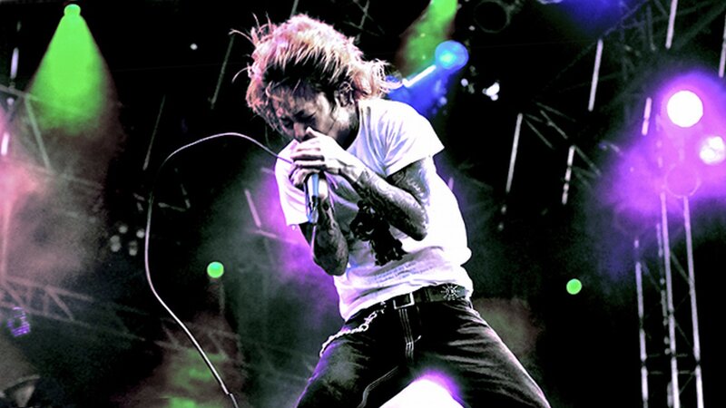 Singer Performing on Stage — Purple