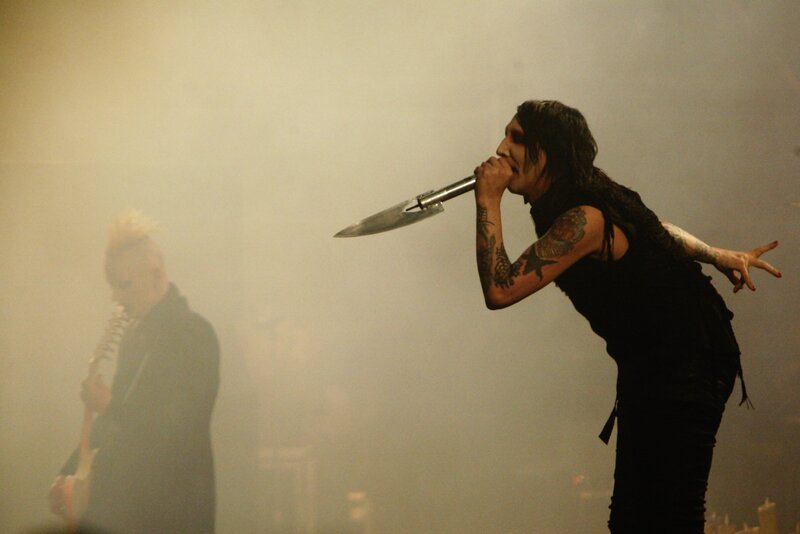 Singer with knife microphone