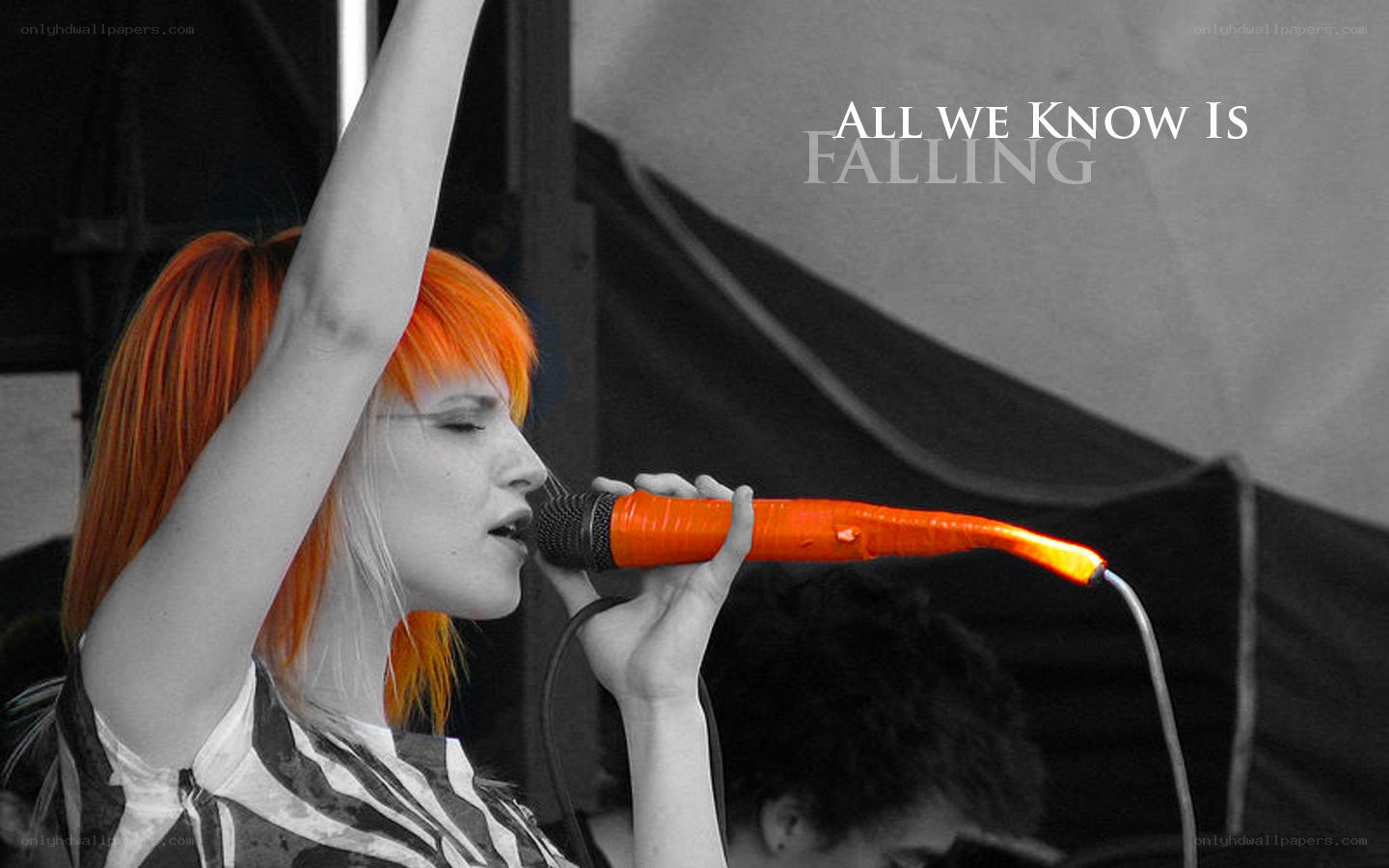 singer with orange hair performing