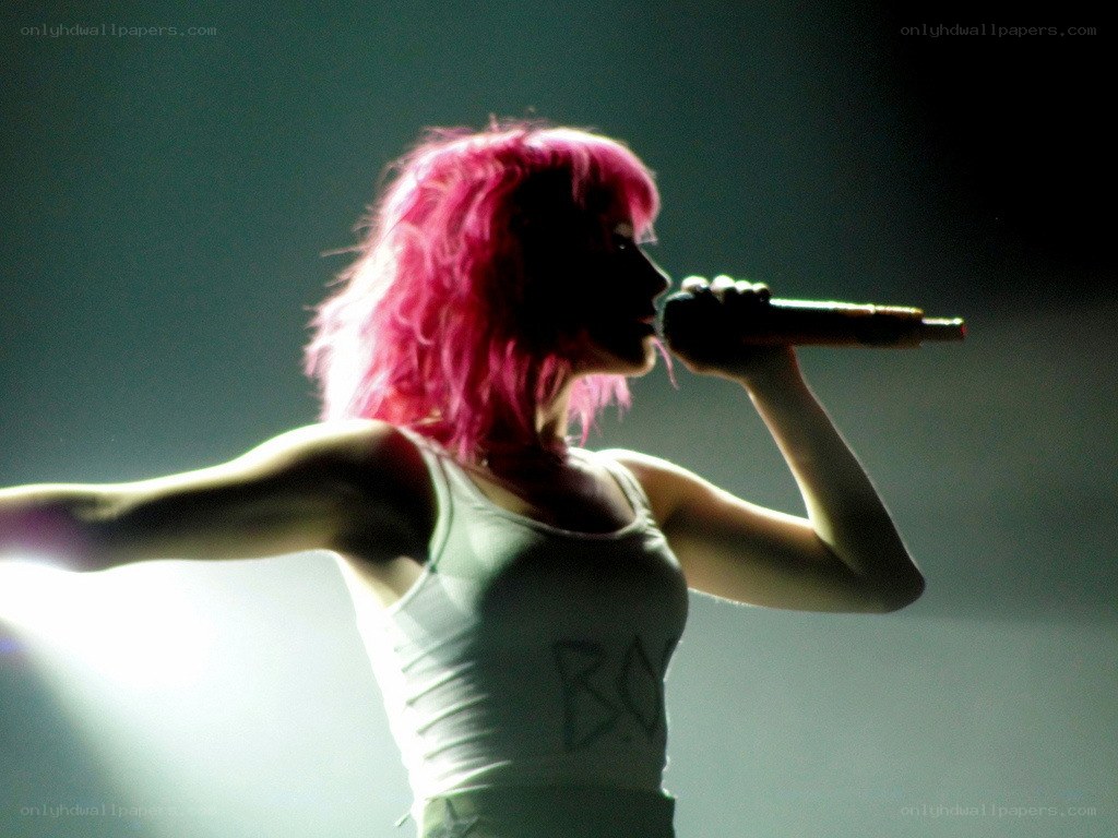 singer with pink hair performing