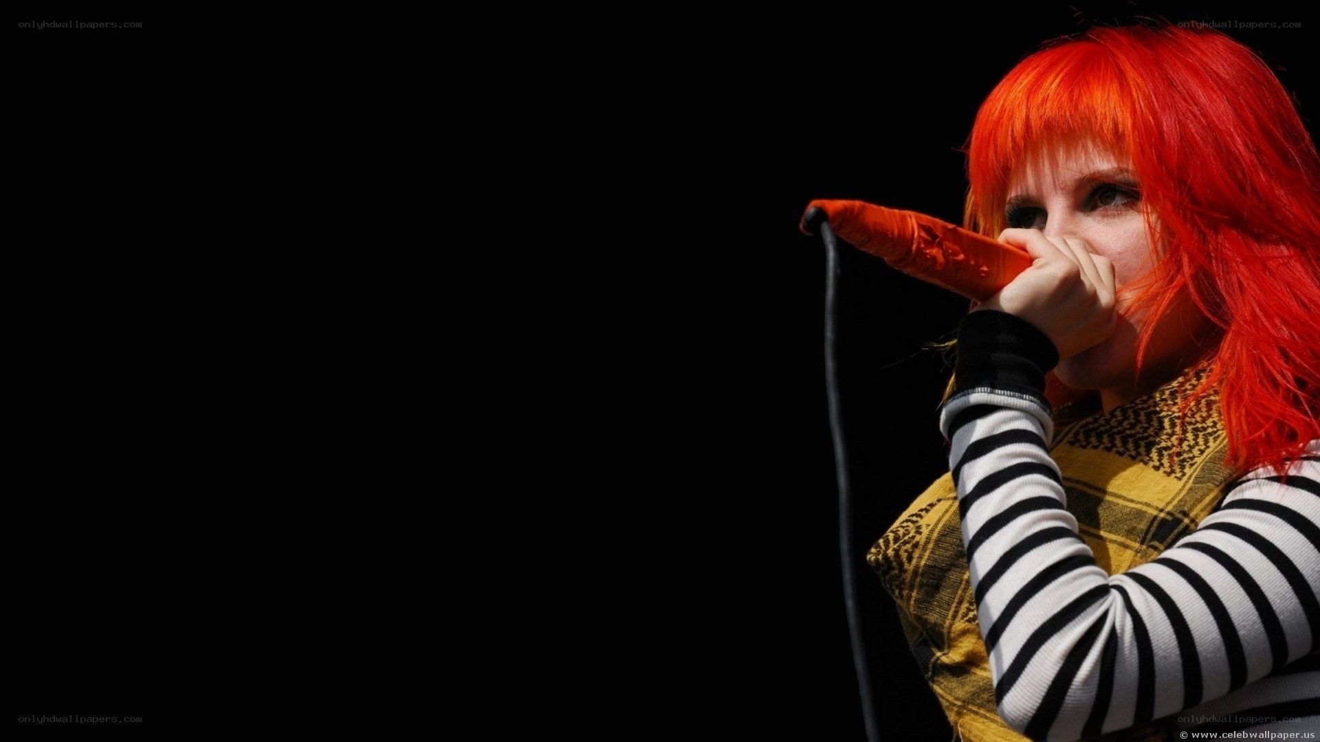 singer with red hair performing