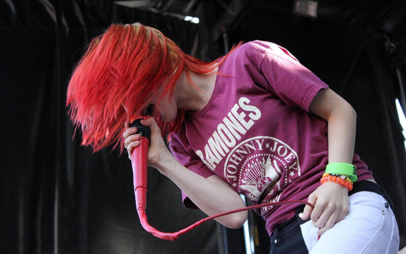 singer with red hair performing