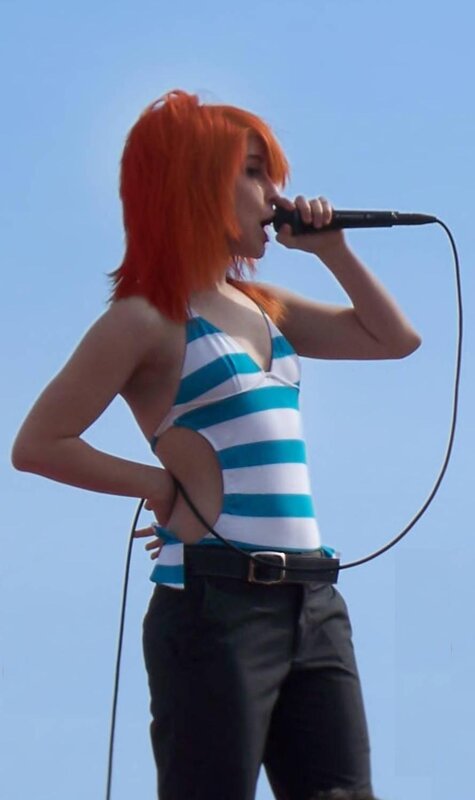 singer with red hair performing
