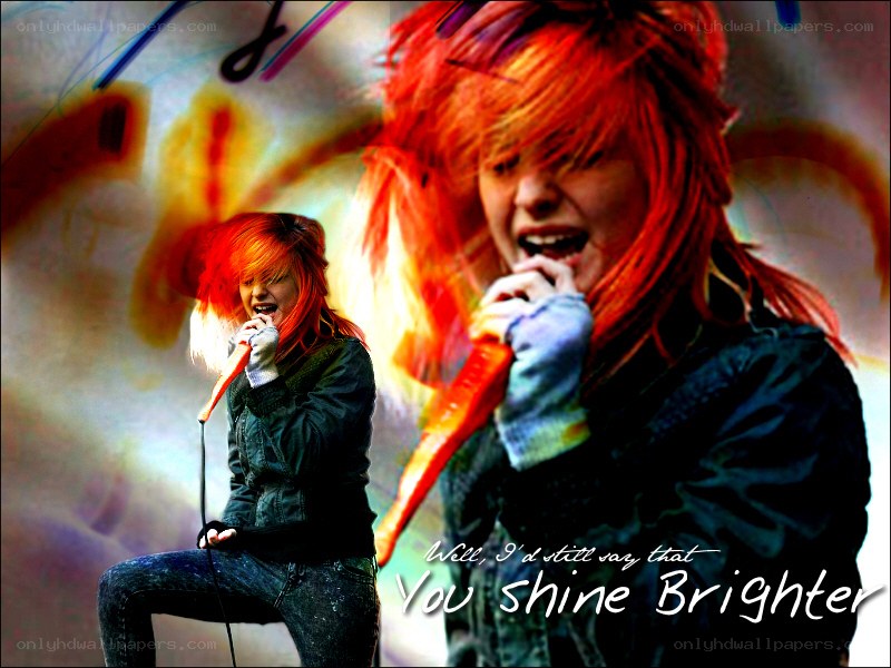 singer with red hair performing