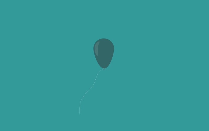 single balloon in teal space