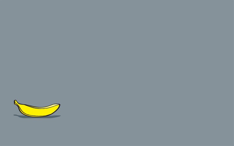 single banana on gray background