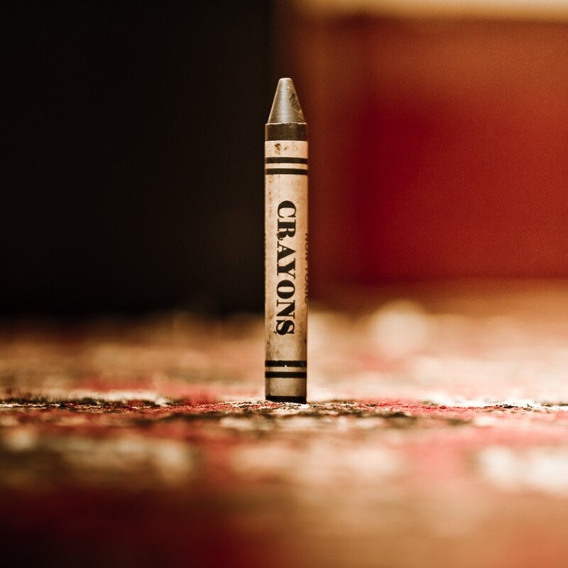 Single crayon standing upright