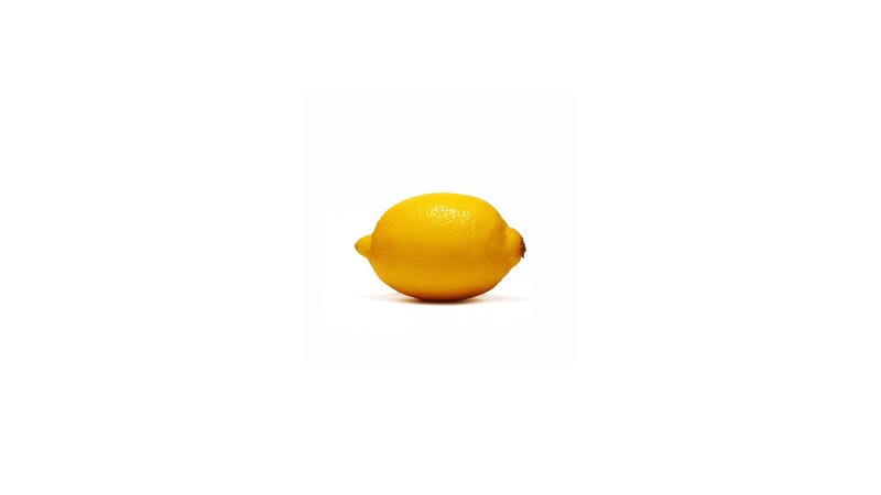 single lemon on white background