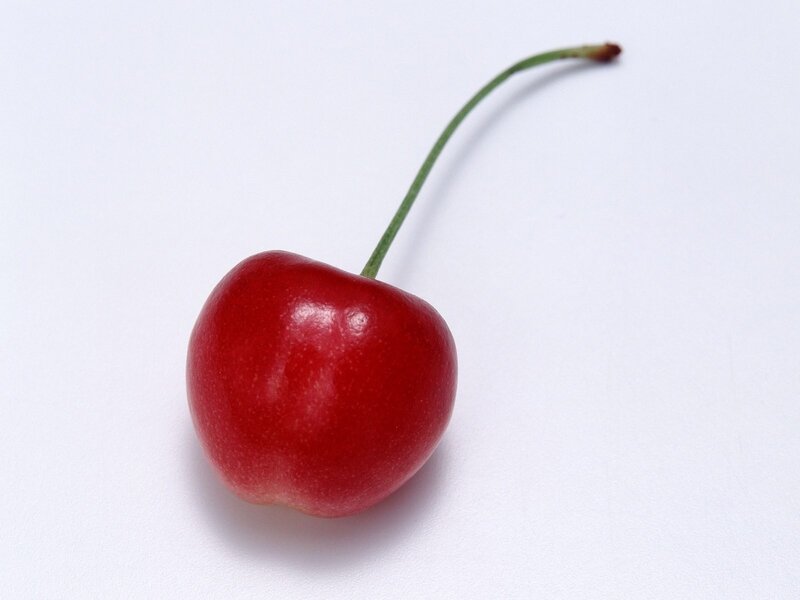 single red cherry with stem
