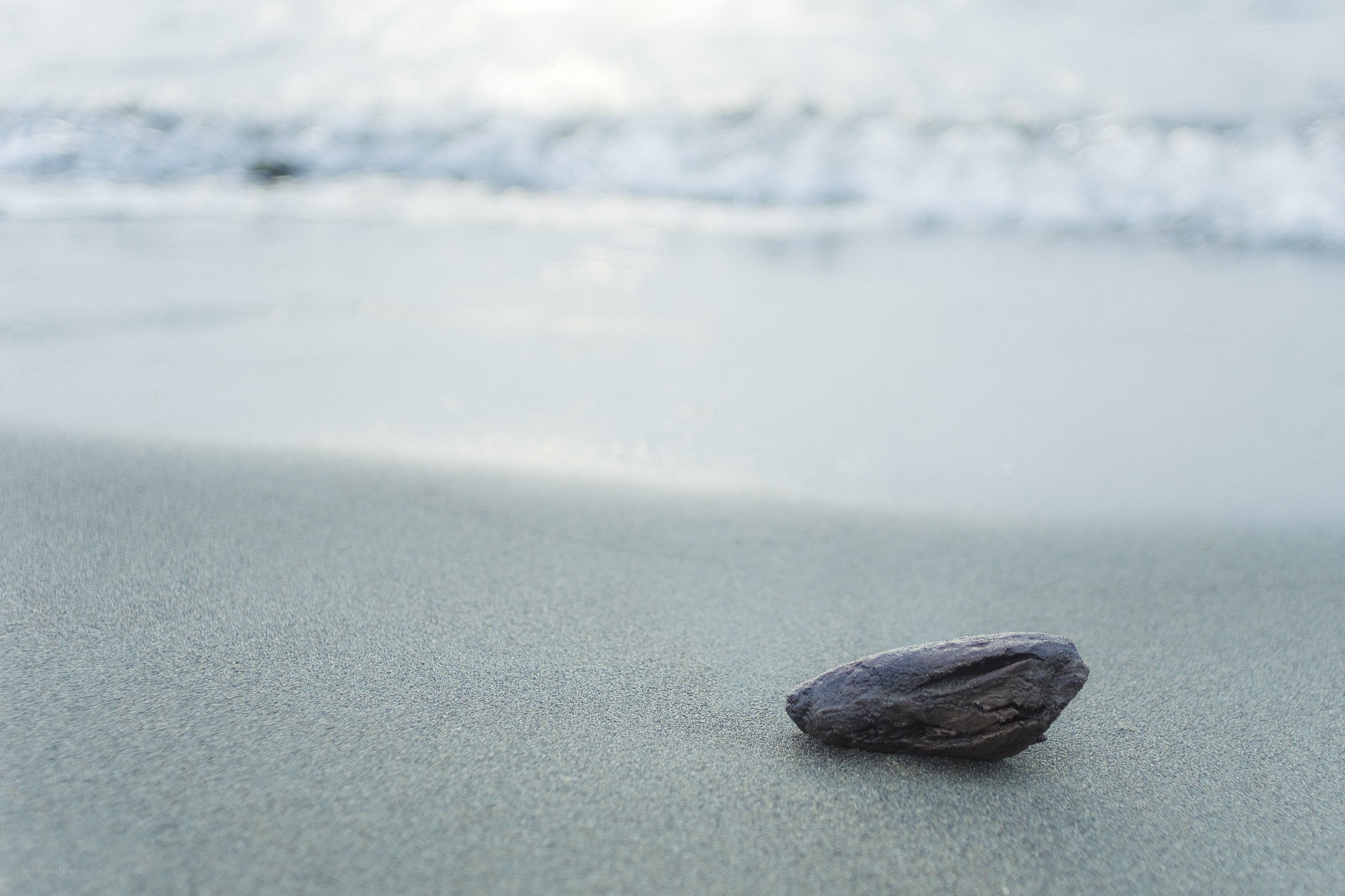 single rock on beach