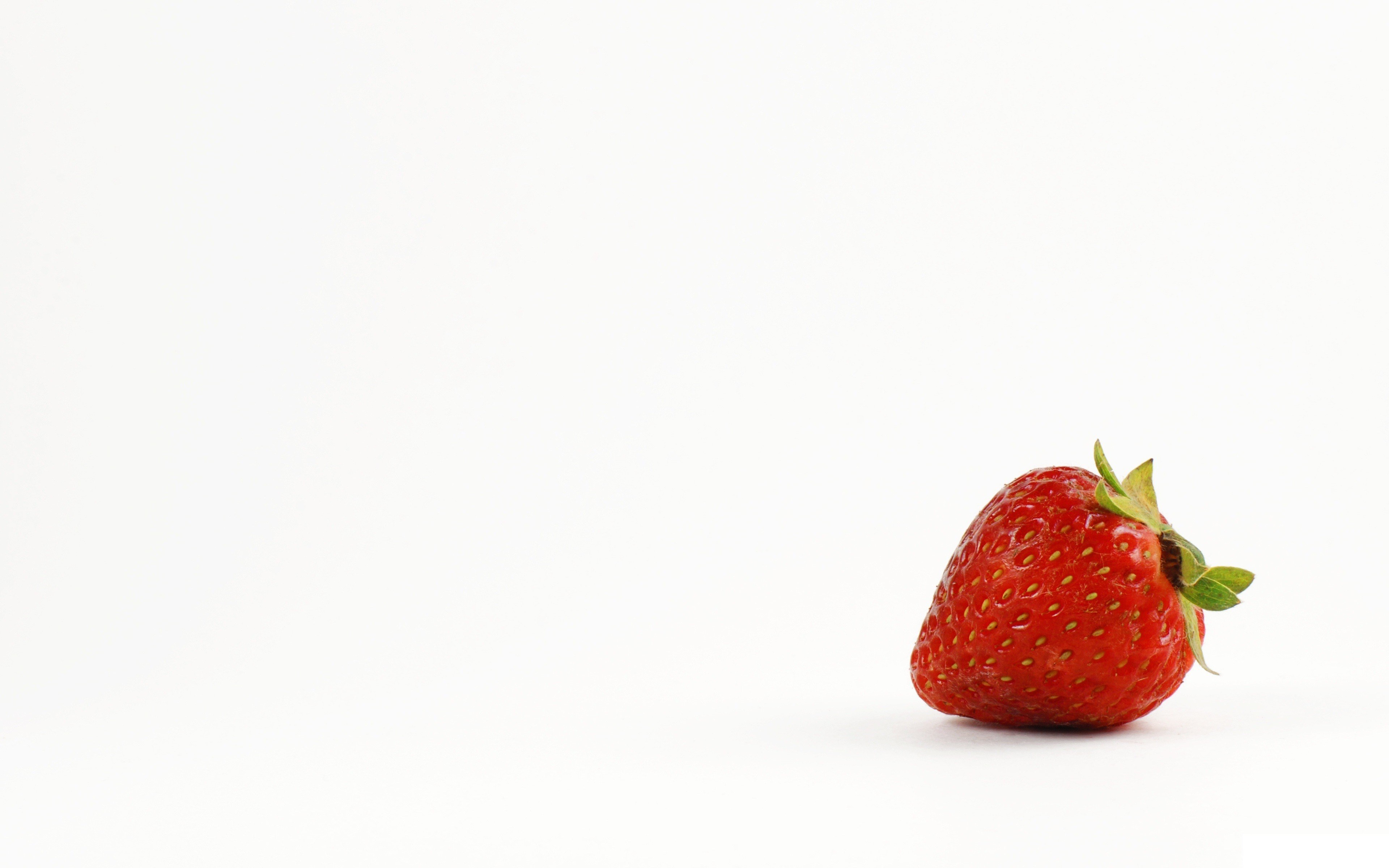 single strawberry on white background