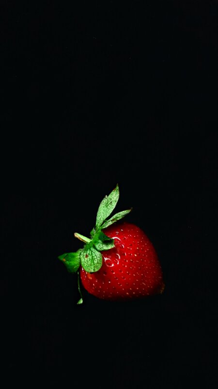Single Strawberry — Red, Dramatic, Photograph, Green Leaves, Black Background