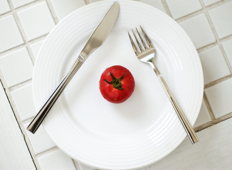Single tomato on a plate