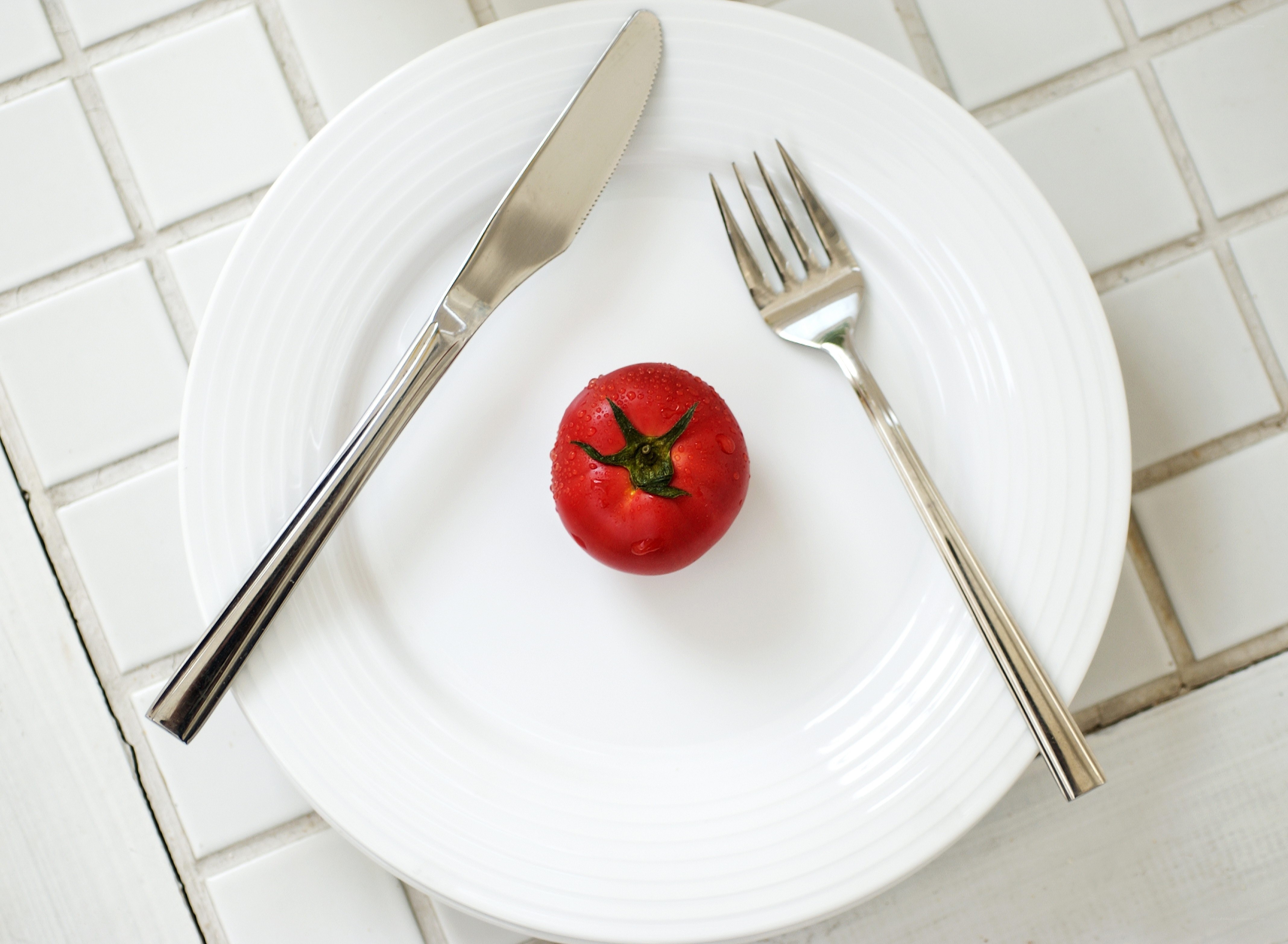 Single tomato on a plate